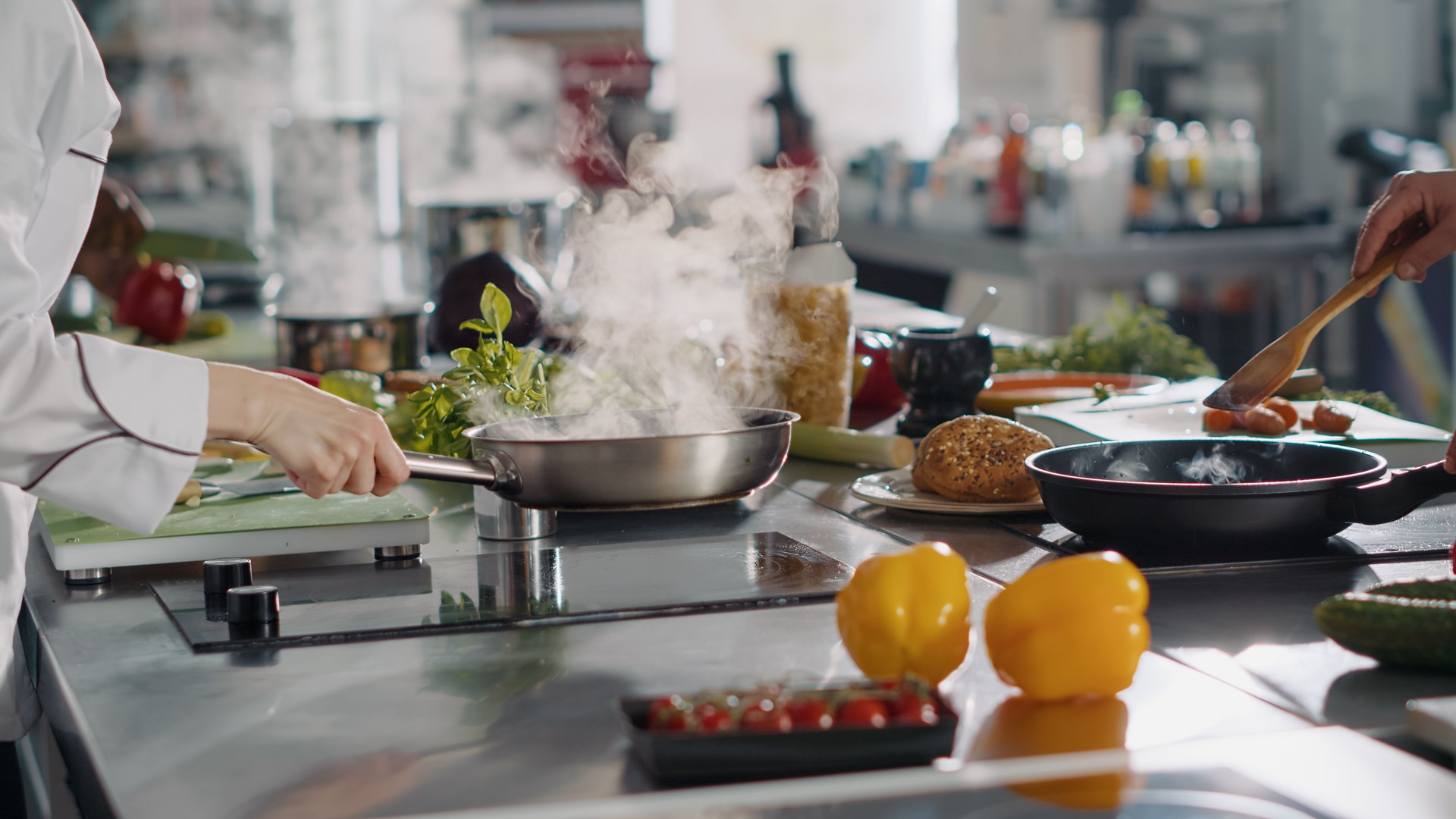 Professional cook preparing gastronomy dish in frying pan
